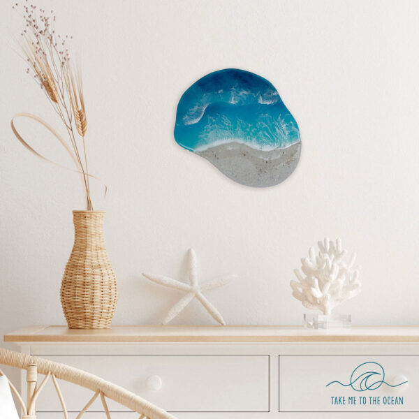 Organic shaped resin ocean art. Haning on a wall in a beach home decor